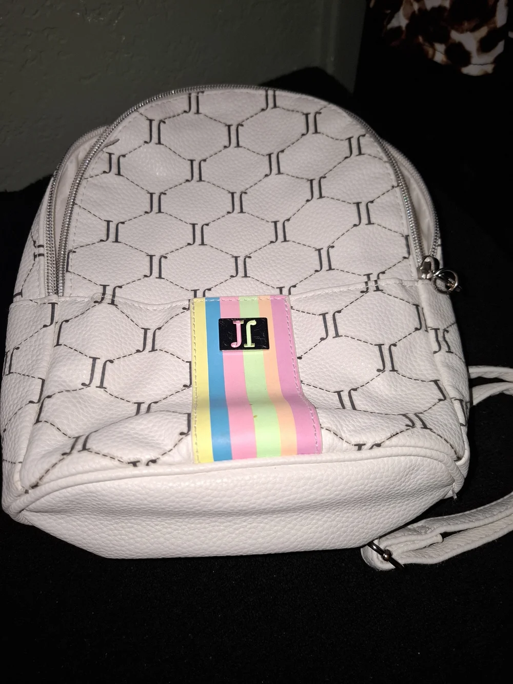 Justice mini backpack featuring an all-over 